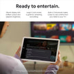 Porcelain Android tablet held in hands with video menu on the screen