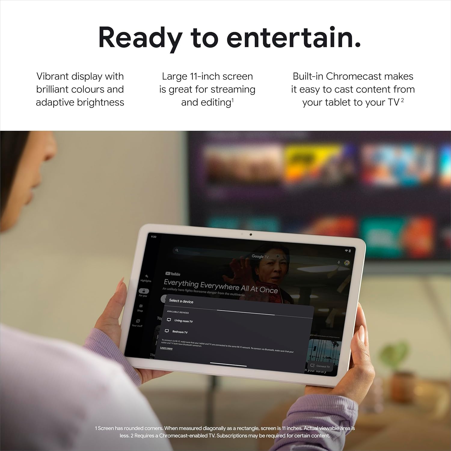 Porcelain Android tablet held in hands with video menu on the screen