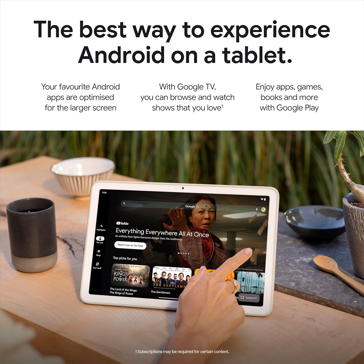 Porcelain Android tablet on a table displaying Google TV content